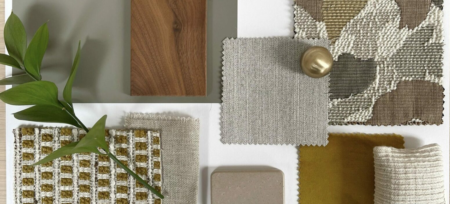 A Close Up Of A Collection Of Green, Gold And Brown Materials On A White Sheet