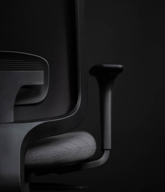 A Close Up Of The Back Of A Task One Black Office Chair