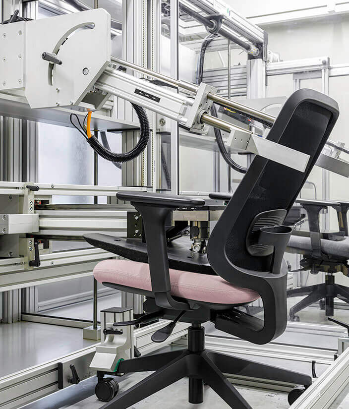 Task One Black Frame Office Chair With Arms and Pink Seat In Production