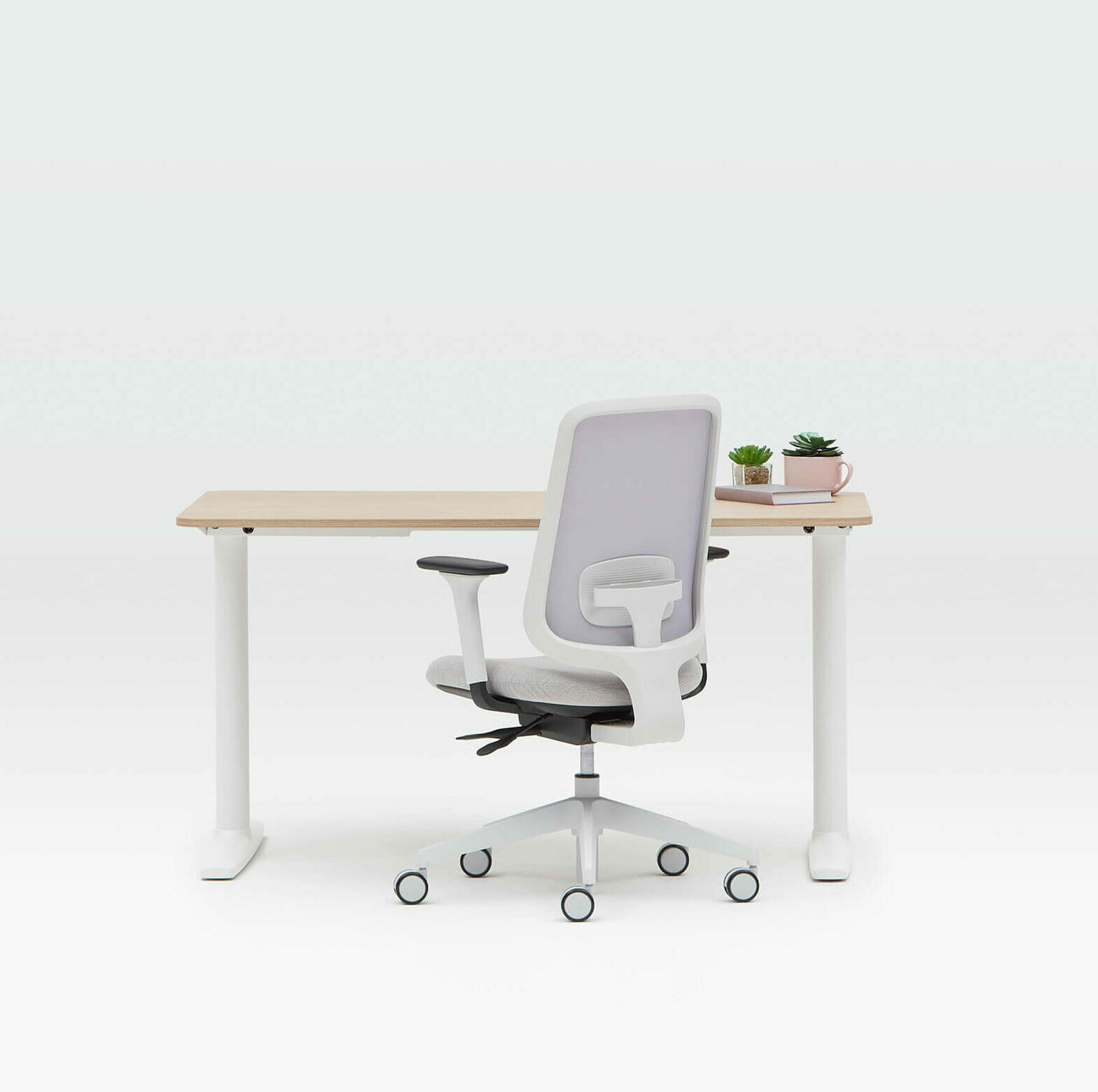 Task One Grey Frame Office Chair With Arms And Fog Seat Next To A Desk One Fixed Height White Frame Desk And Oak Top