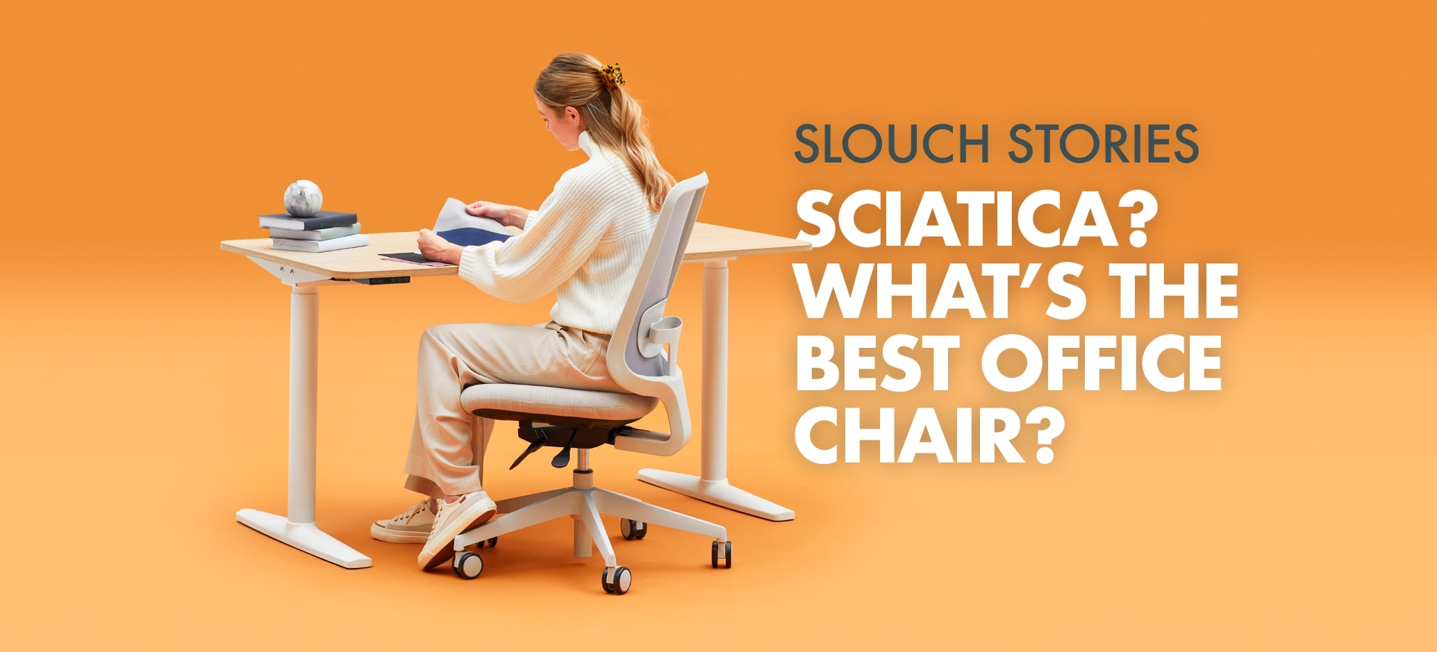 Person Sitting on a Task One Slouch Chair Whilst Working at a Slouch Office Desk